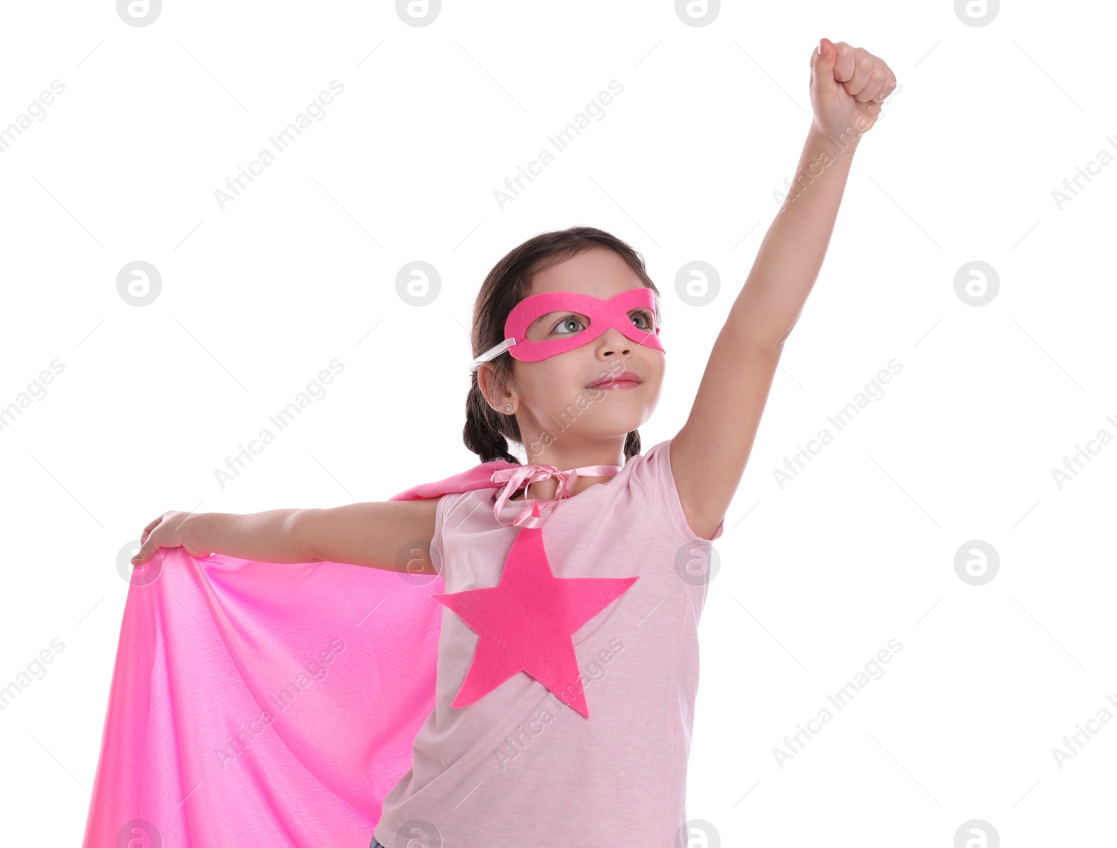 Photo of Cute little girl in superhero suit on white background