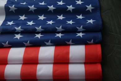 Photo of Flag of USA on black table, closeup