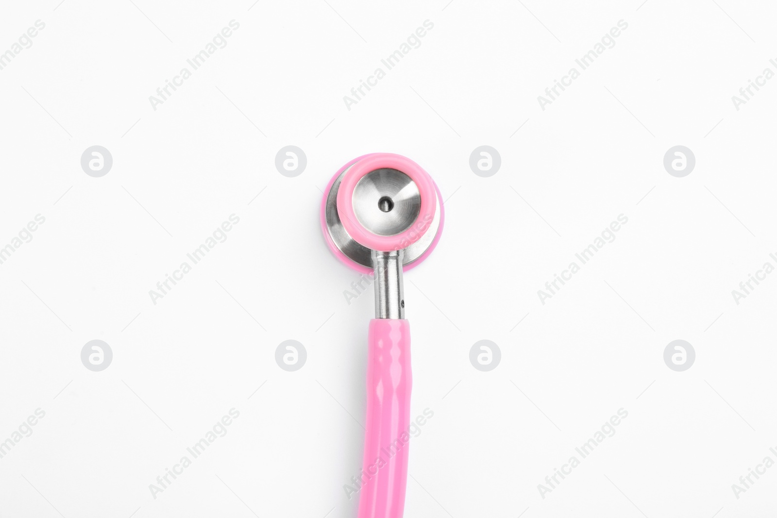 Photo of Pink stethoscope isolated on white, top view. Breast cancer awareness