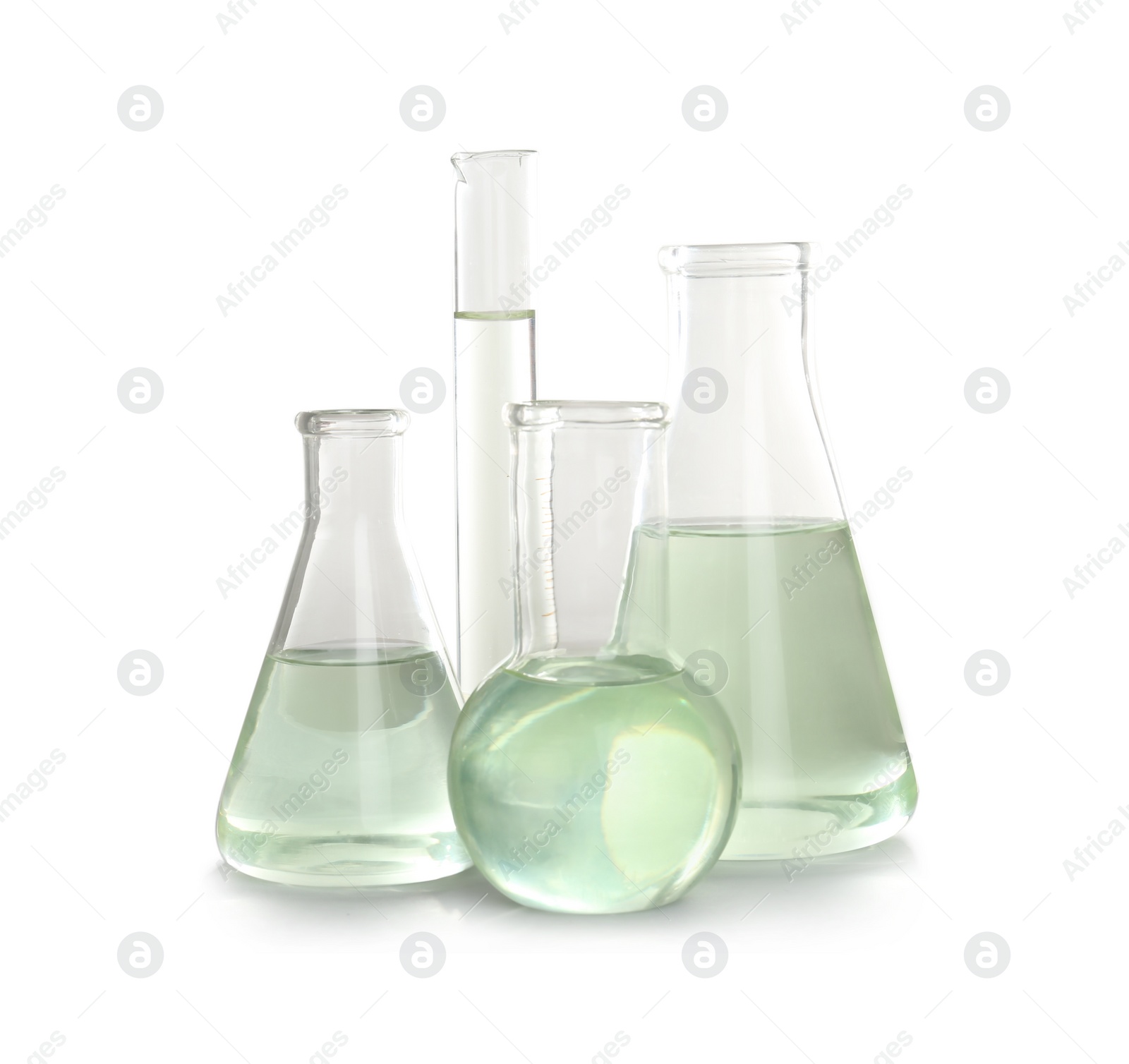 Photo of Laboratory glassware with liquid on white background. Chemical analysis