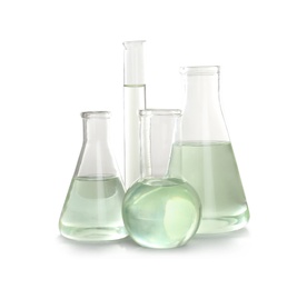 Laboratory glassware with liquid on white background. Chemical analysis