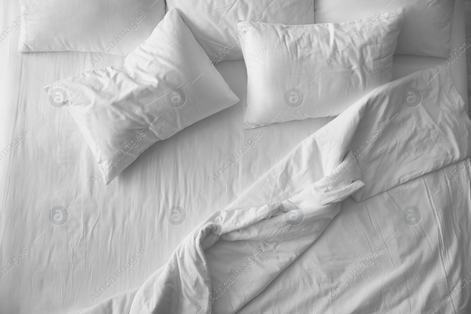 Photo of Soft pillows on comfortable bed, top view