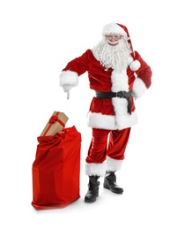 Photo of Authentic Santa Claus with red bag full of gifts on white background