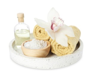 Photo of Spa composition. Towels, essential oil, sea salt and beautiful flower on white background