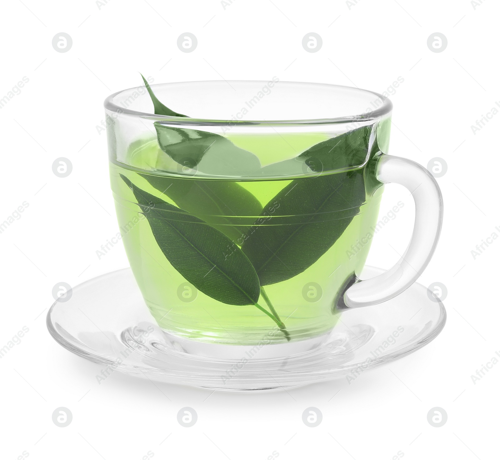 Photo of Fresh green tea in glass cup, leaves and saucer isolated on white