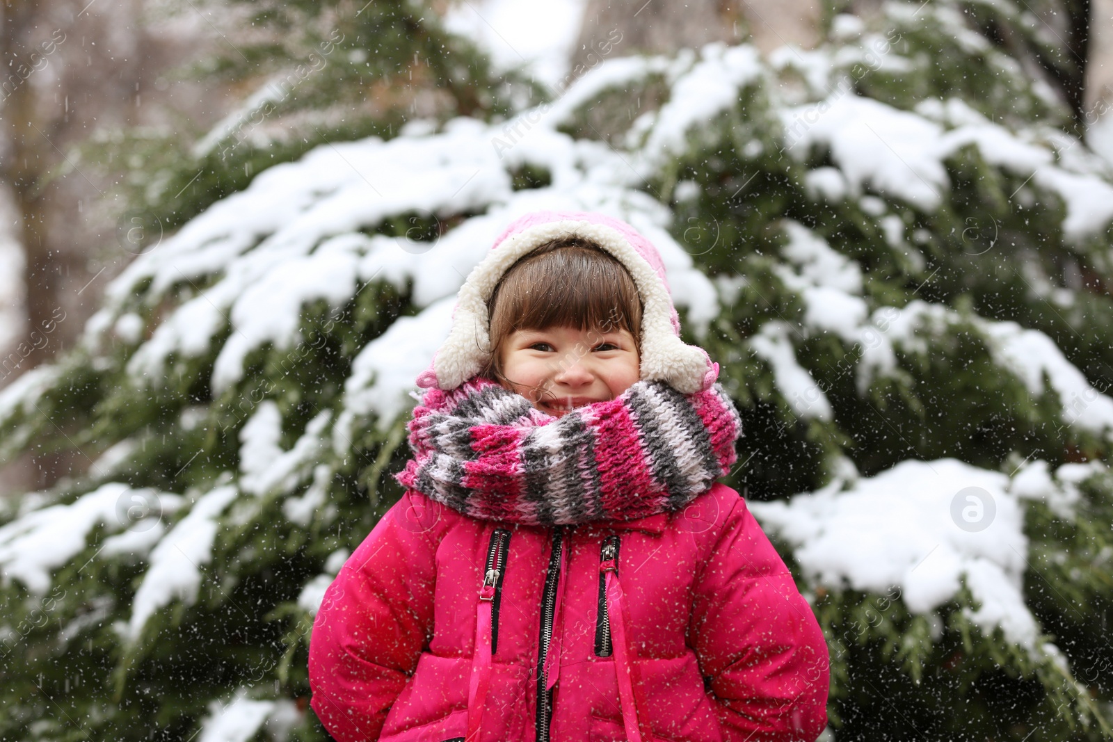 Photo of Portrait of little girl outdoors on snowy day