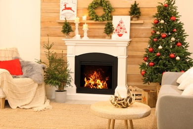 Beautiful living room interior with burning fireplace. Christmas celebration