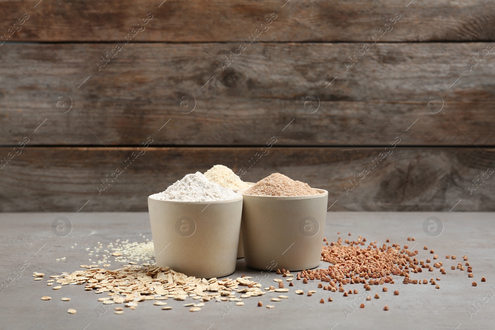 Photo of Composition with different types of flour on table. Space for text