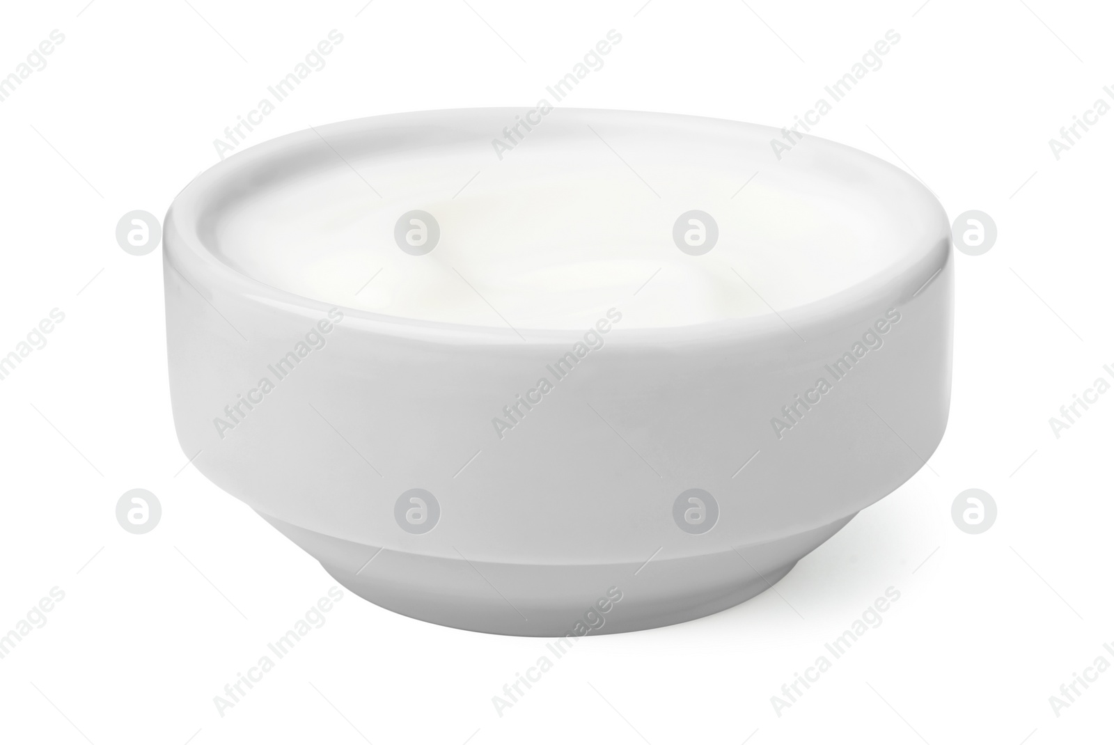 Photo of Delicious natural yogurt in bowl isolated on white