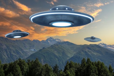 Image of UFO. Alien spaceships flying over mountains. Extraterrestrial visitors