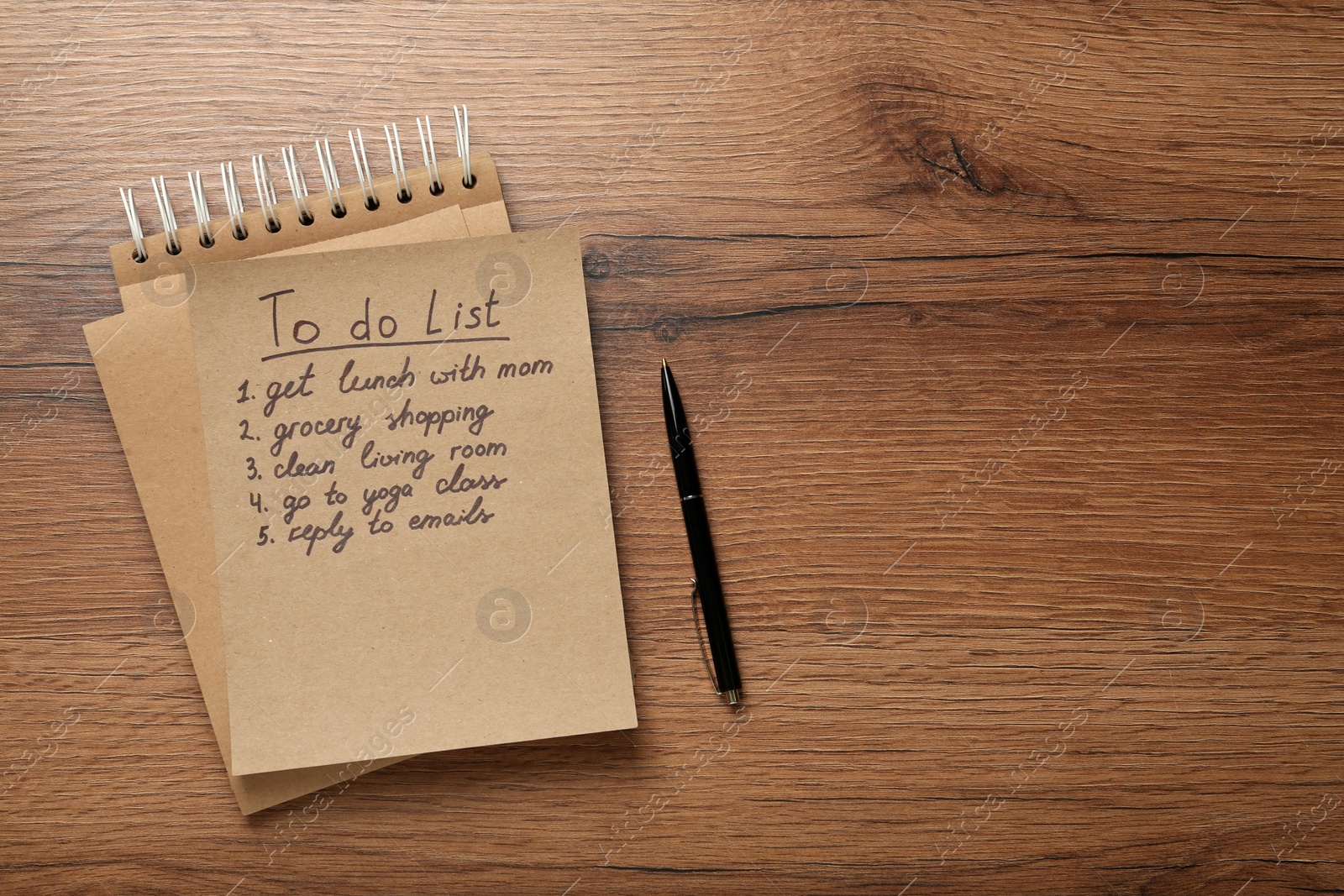 Photo of Notebook and to do list with pen on wooden table, flat lay. Space for text