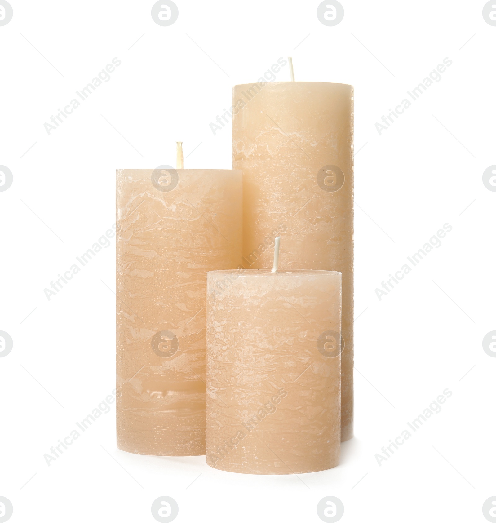 Photo of Three color wax candles on white background