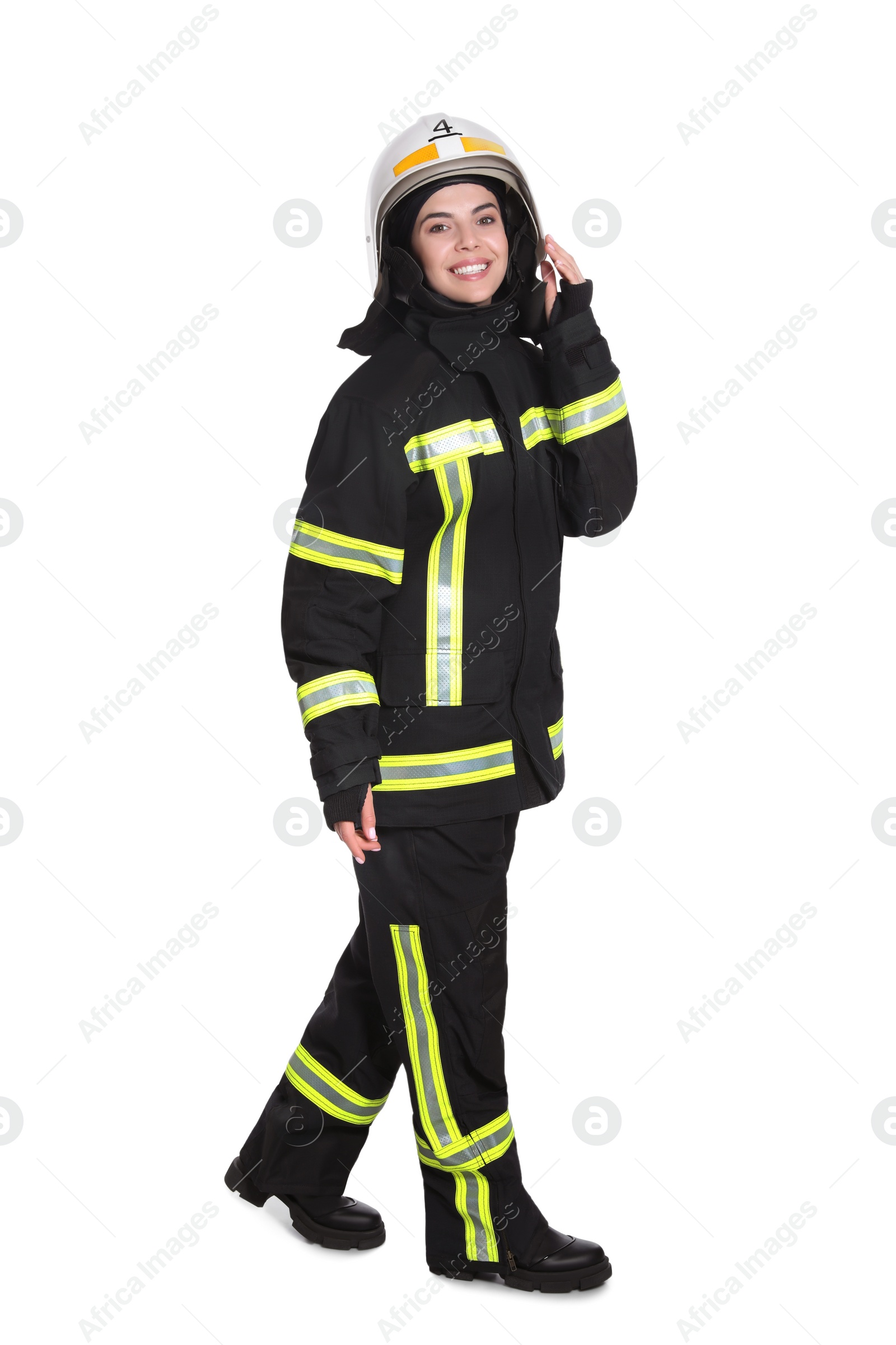 Photo of Full length portrait of firefighter in uniform and helmet on white background