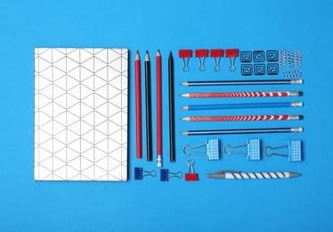 Photo of Flat lay composition with different school stationery on color background