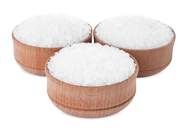 Photo of Wooden bowls with natural sea salt isolated on white