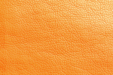 Image of Texture of orange leather as background, closeup