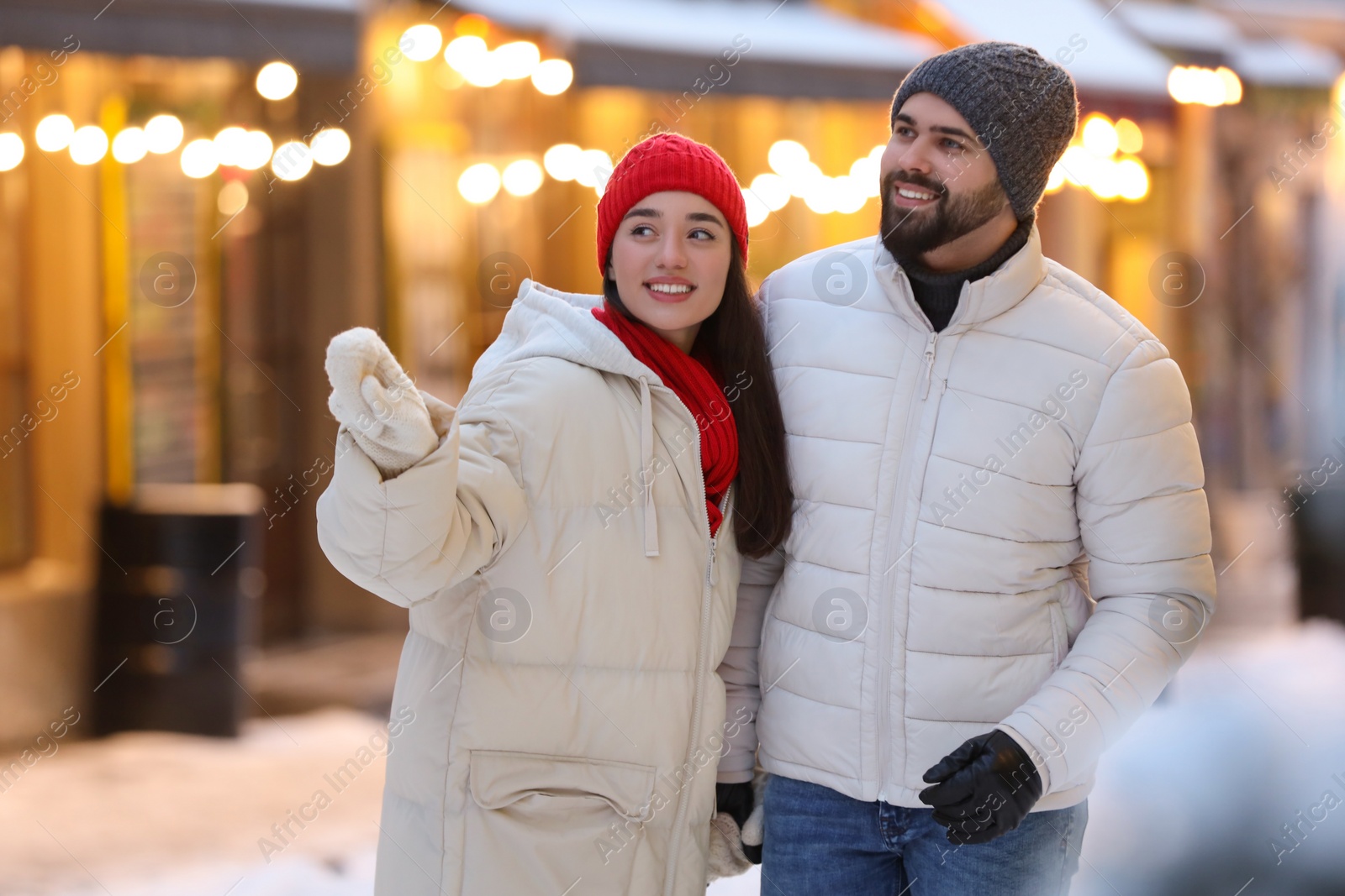 Photo of Lovely couple spending time together on city street