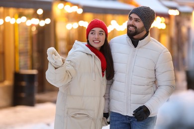 Photo of Lovely couple spending time together on city street