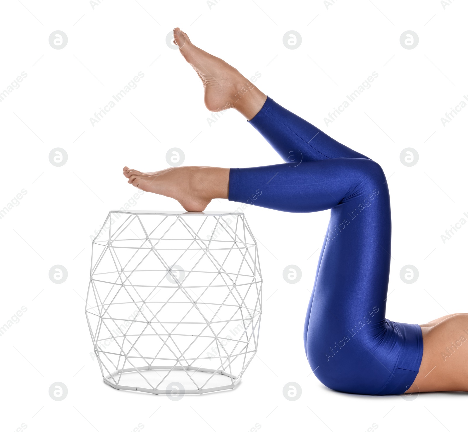 Photo of Woman with beautiful long legs wearing blue leggings on white background, closeup