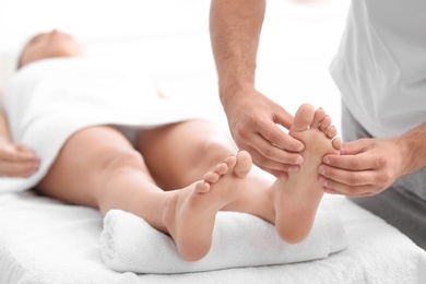 Young woman receiving massage in salon, closeup