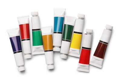 Tubes with oil paints on white background, top view