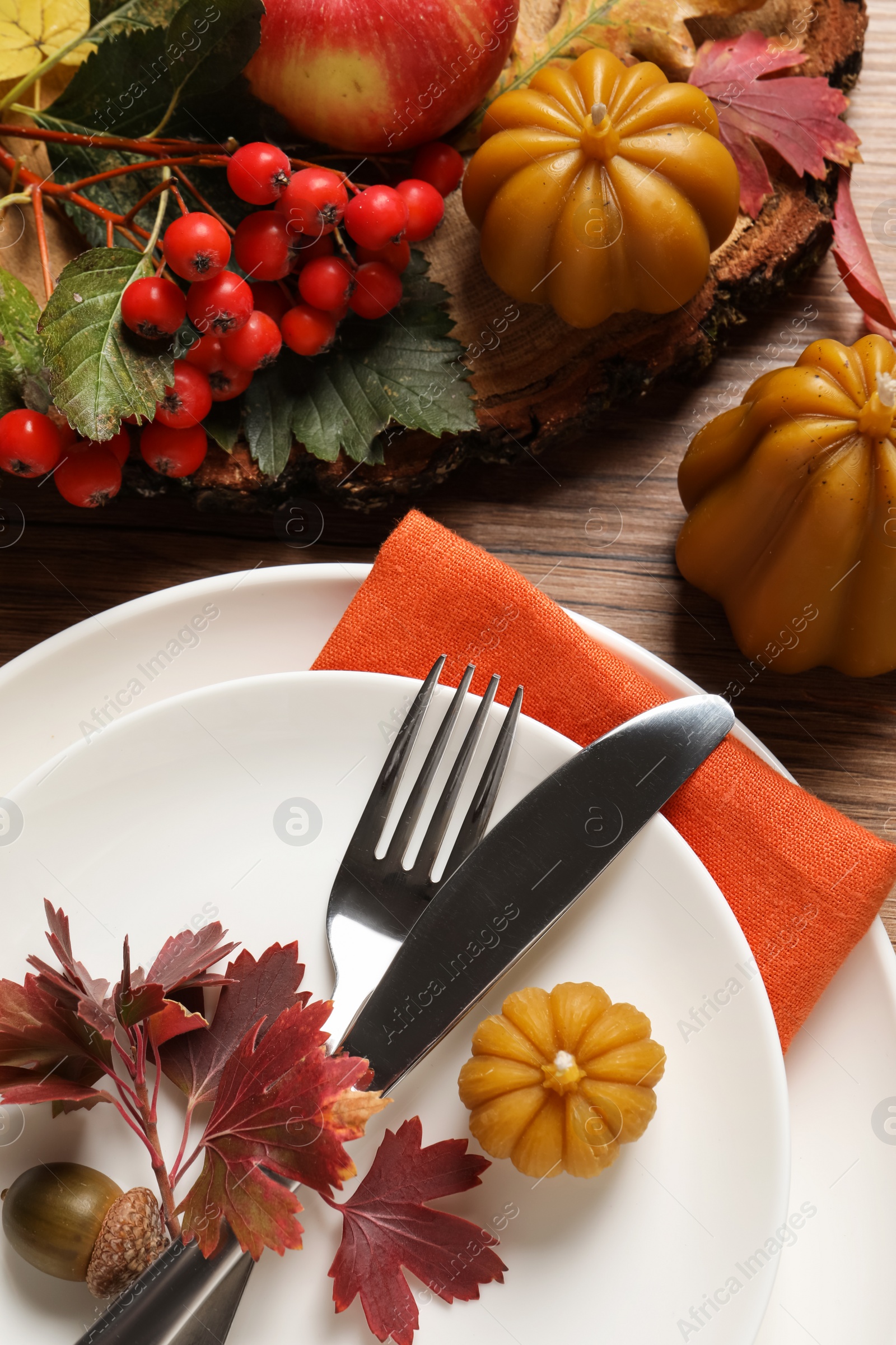 Photo of Festive table setting with autumn decor on wooden background, flat lay