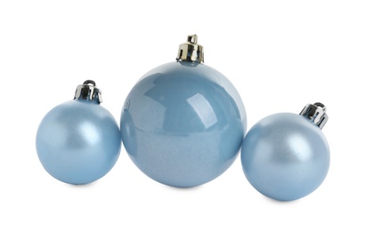 Photo of Beautiful light blue Christmas balls on white background