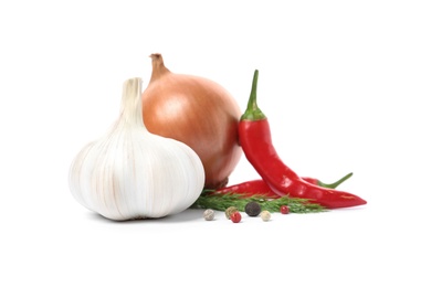 Photo of Garlic, onion, chili peppers, allspice and dill on white background