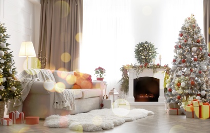 Image of Festive living room interior with Christmas trees and fireplace