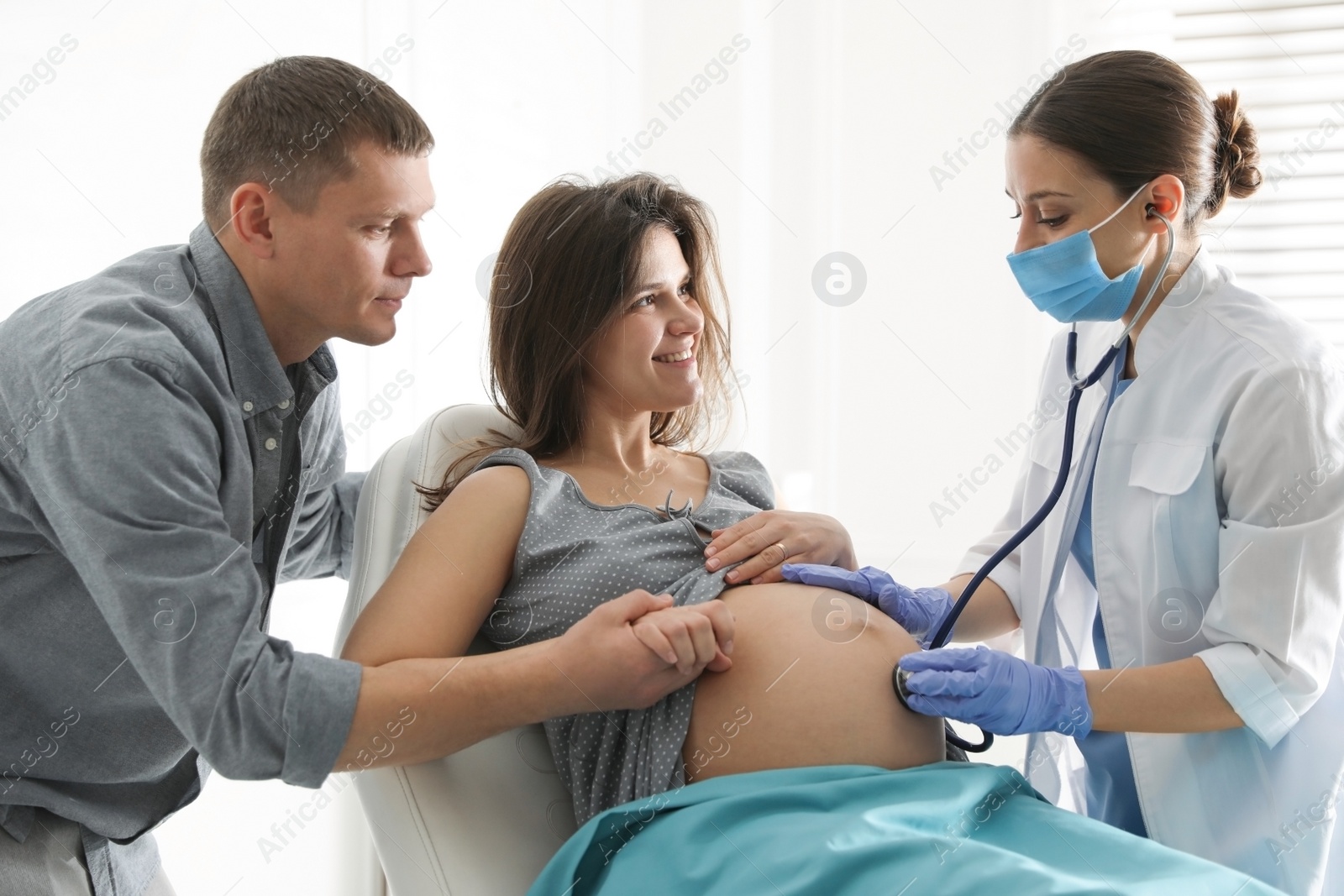 Photo of Doctor examining woman before giving child birth in maternity hospital