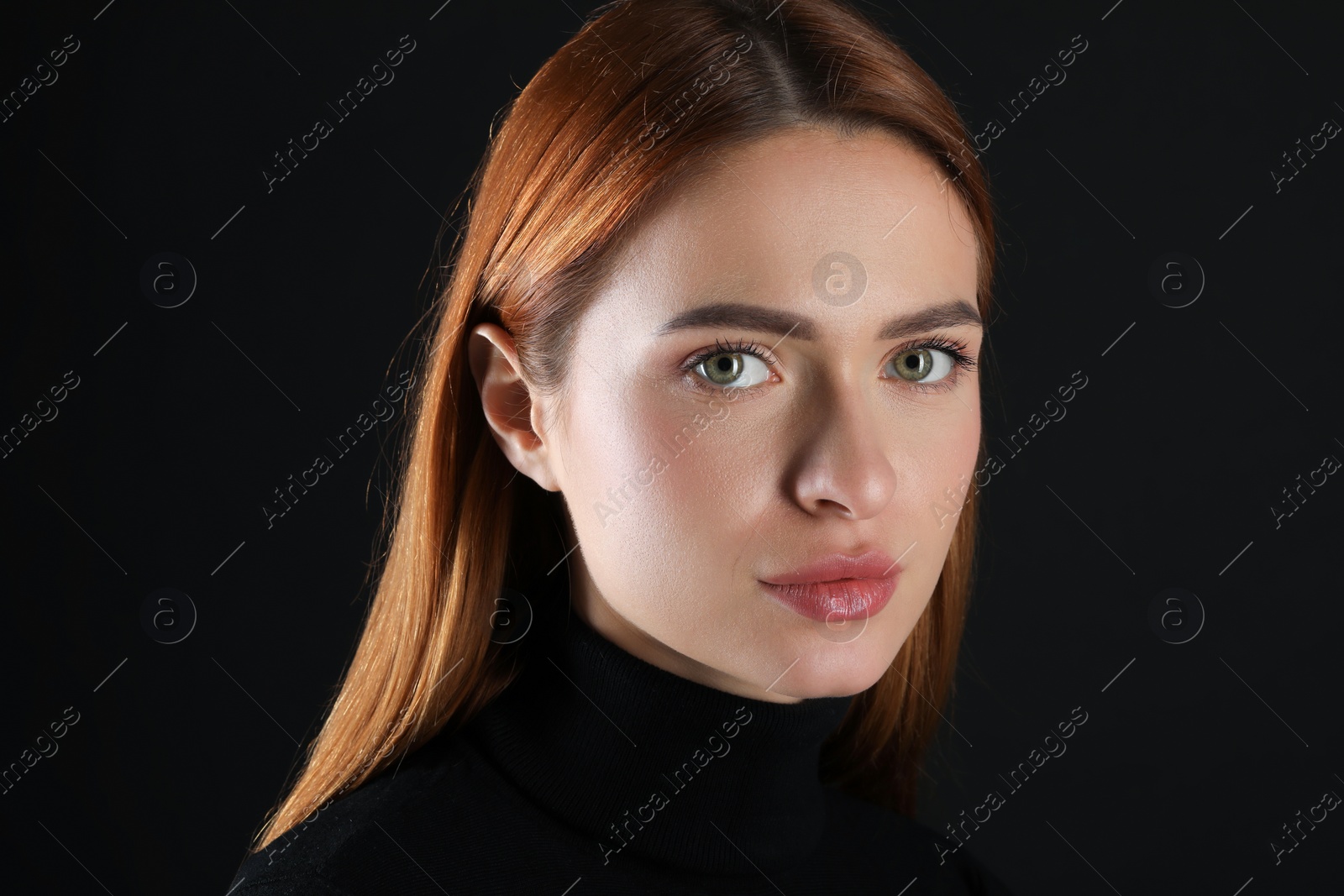 Photo of Evil eye. Young woman with scary eyes on black background