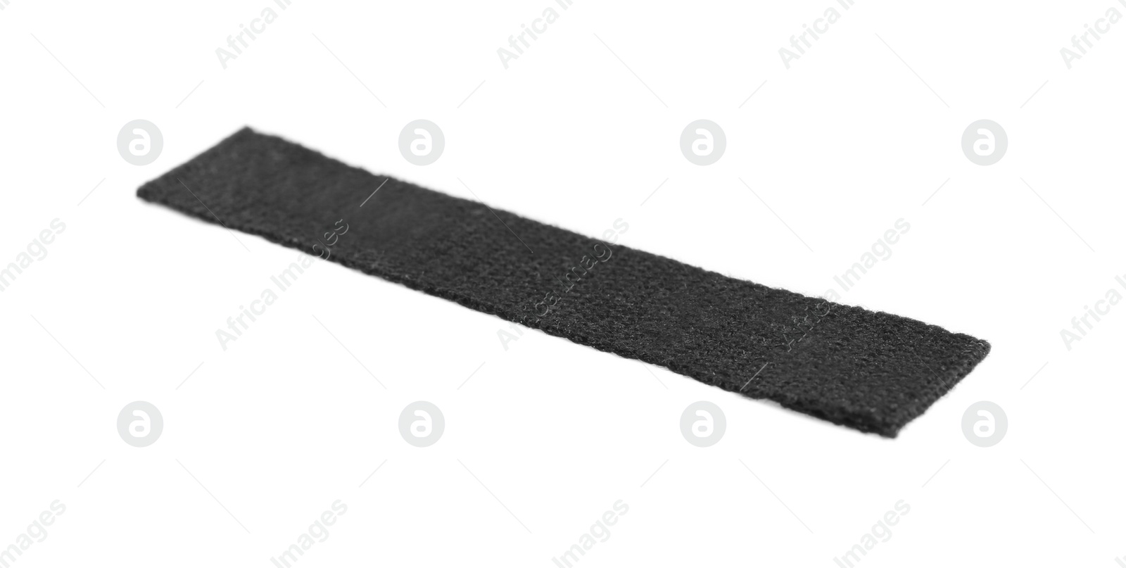 Photo of Blank black clothing label isolated on white