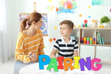 Image of Pairing. Mother and her son drawing together at home