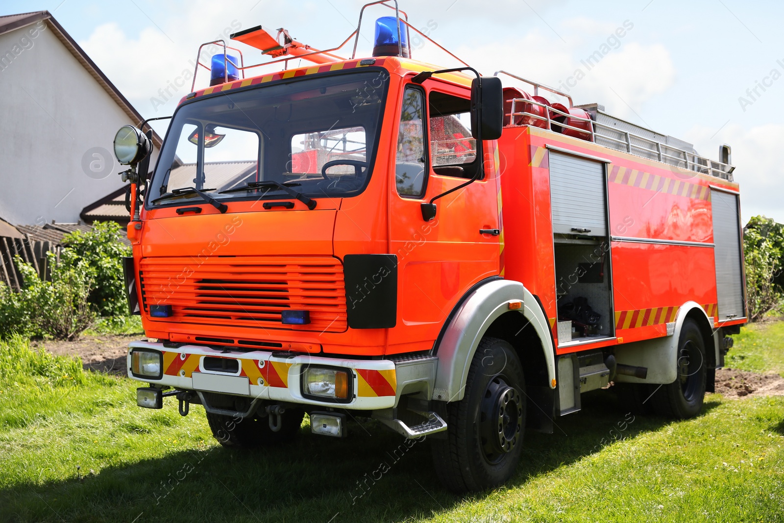 Photo of One modern orange fire truck on sunny day