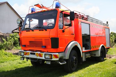 One modern orange fire truck on sunny day