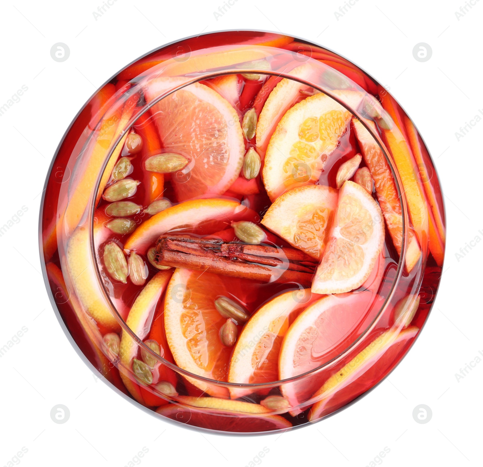 Photo of Glass bowl of aromatic punch drink isolated on white, top view