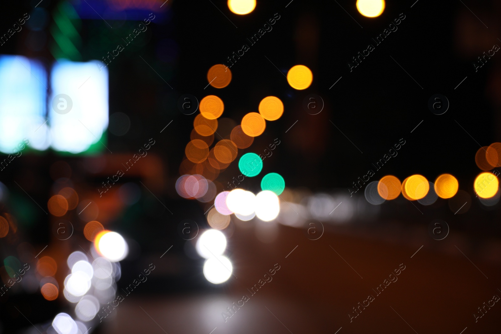 Photo of Blurred view of cityscape with bokeh effect. Night life