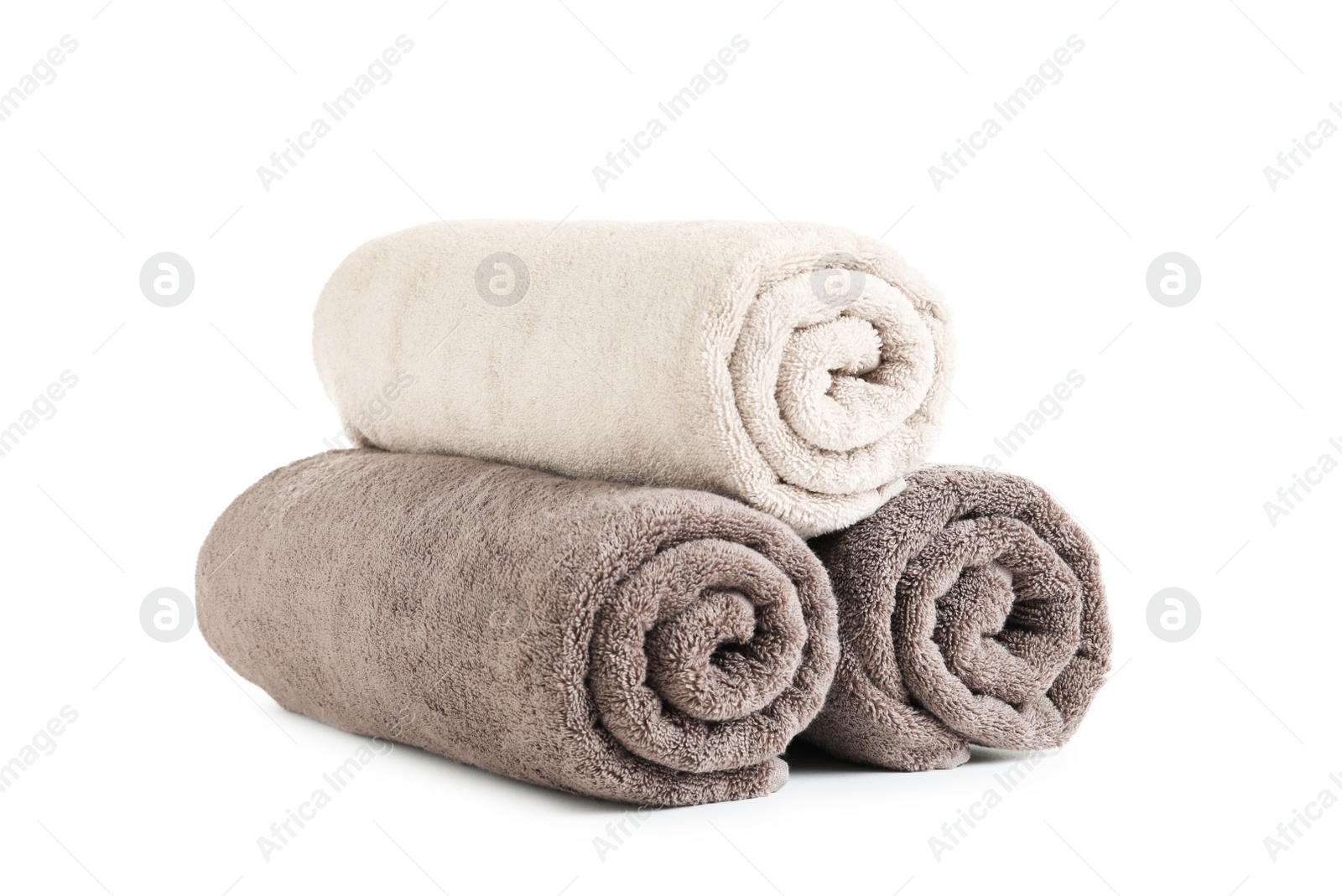 Photo of Fresh soft rolled towels isolated on white