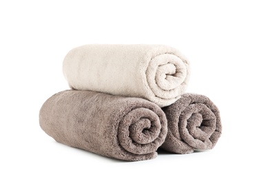 Photo of Fresh soft rolled towels isolated on white