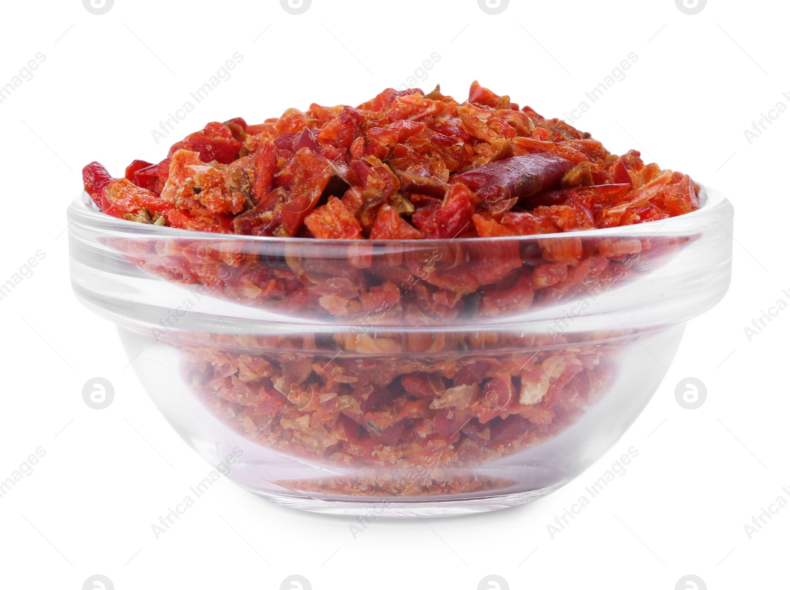 Photo of Aromatic spice. Red chili pepper flakes in bowl isolated on white