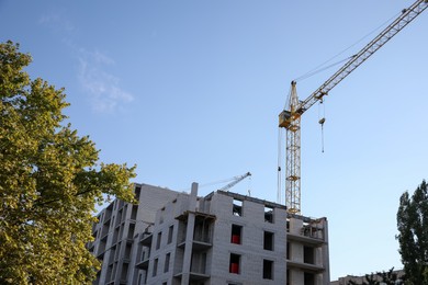 View of unfinished building against blue sky