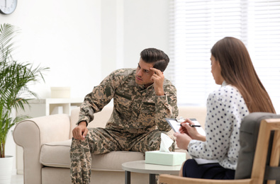 Psychotherapist working with male military officer in office