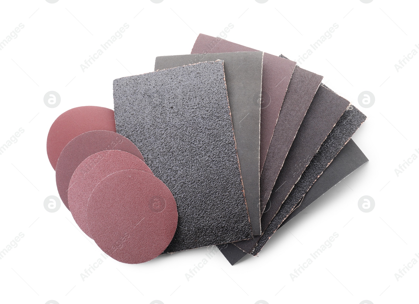 Photo of Many sheets of sandpaper isolated on white, top view