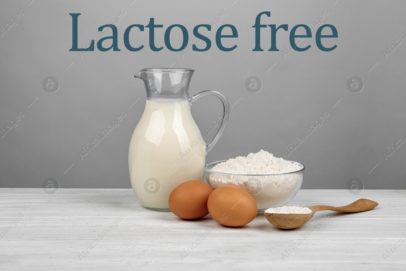 Image of Raw eggs, flour and lactose free milk on white wooden table