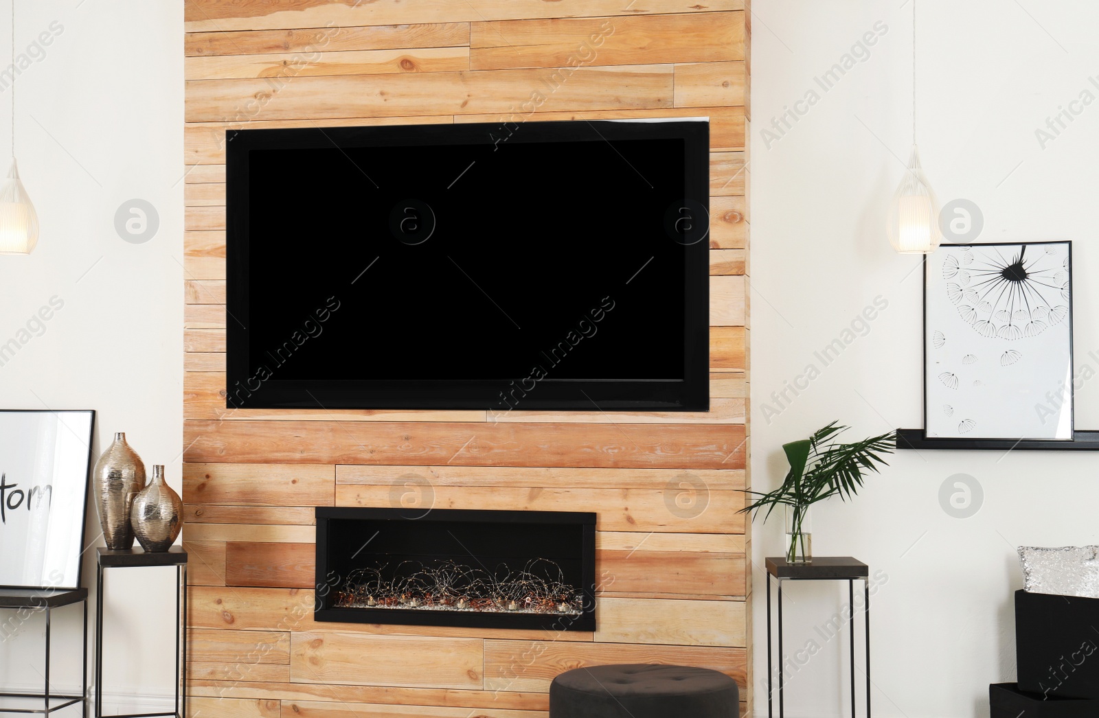 Photo of Living room interior with decorative fireplace in wooden wall