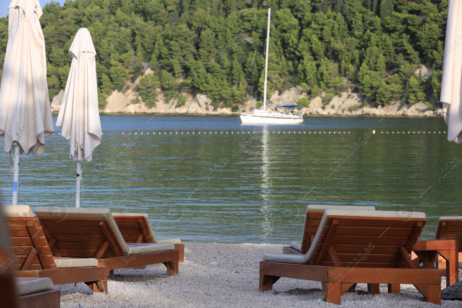 Photo of Many beach umbrellas and sunbeds at resort