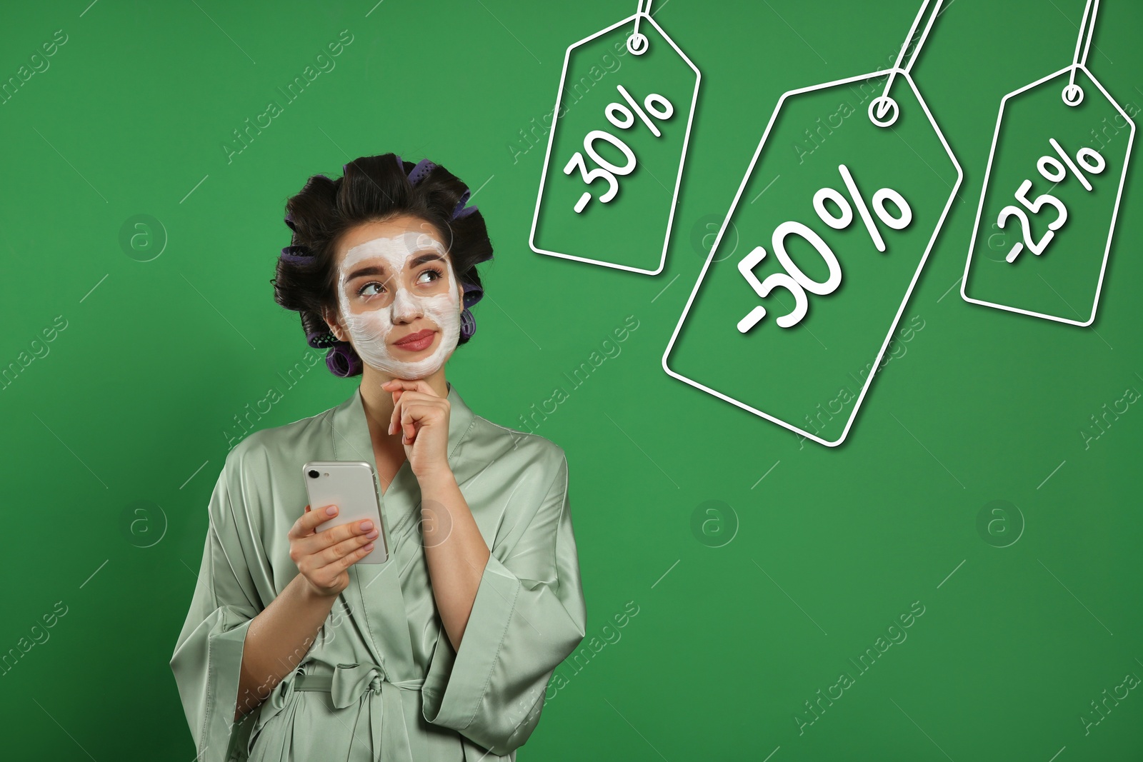 Image of Young woman and tags with discounts on green background. Special promotion