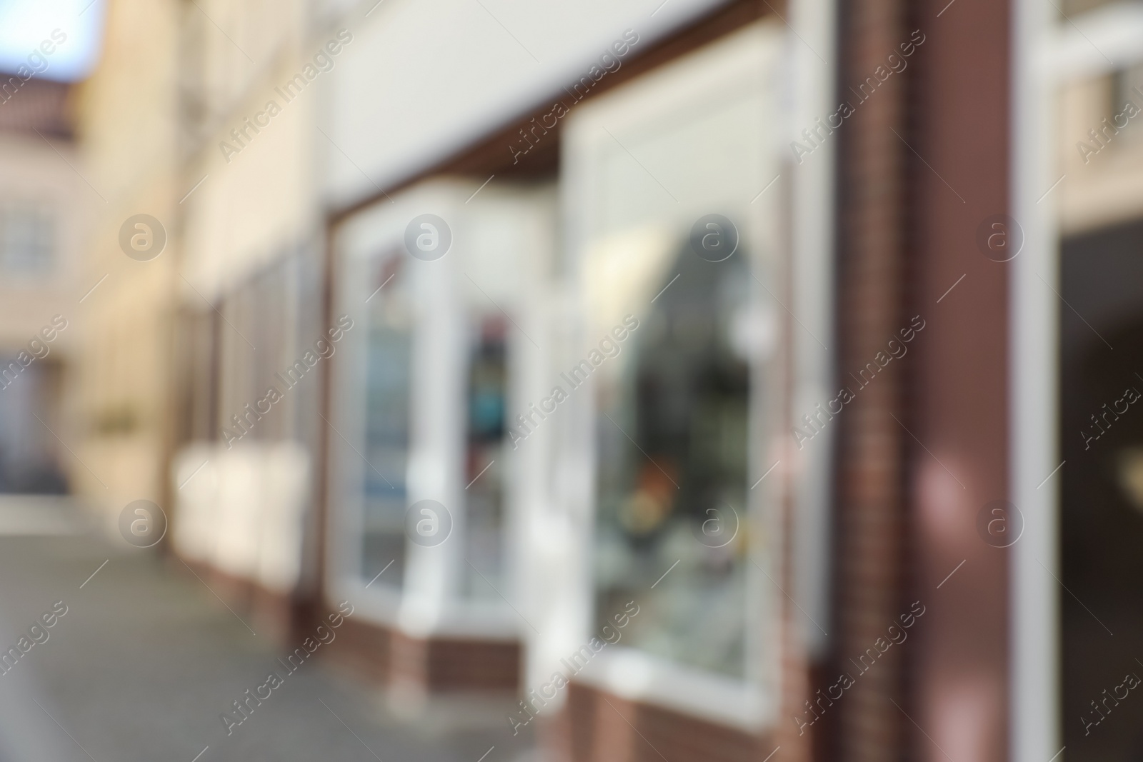 Photo of Blurred view of store exterior and city street. Bokeh effect