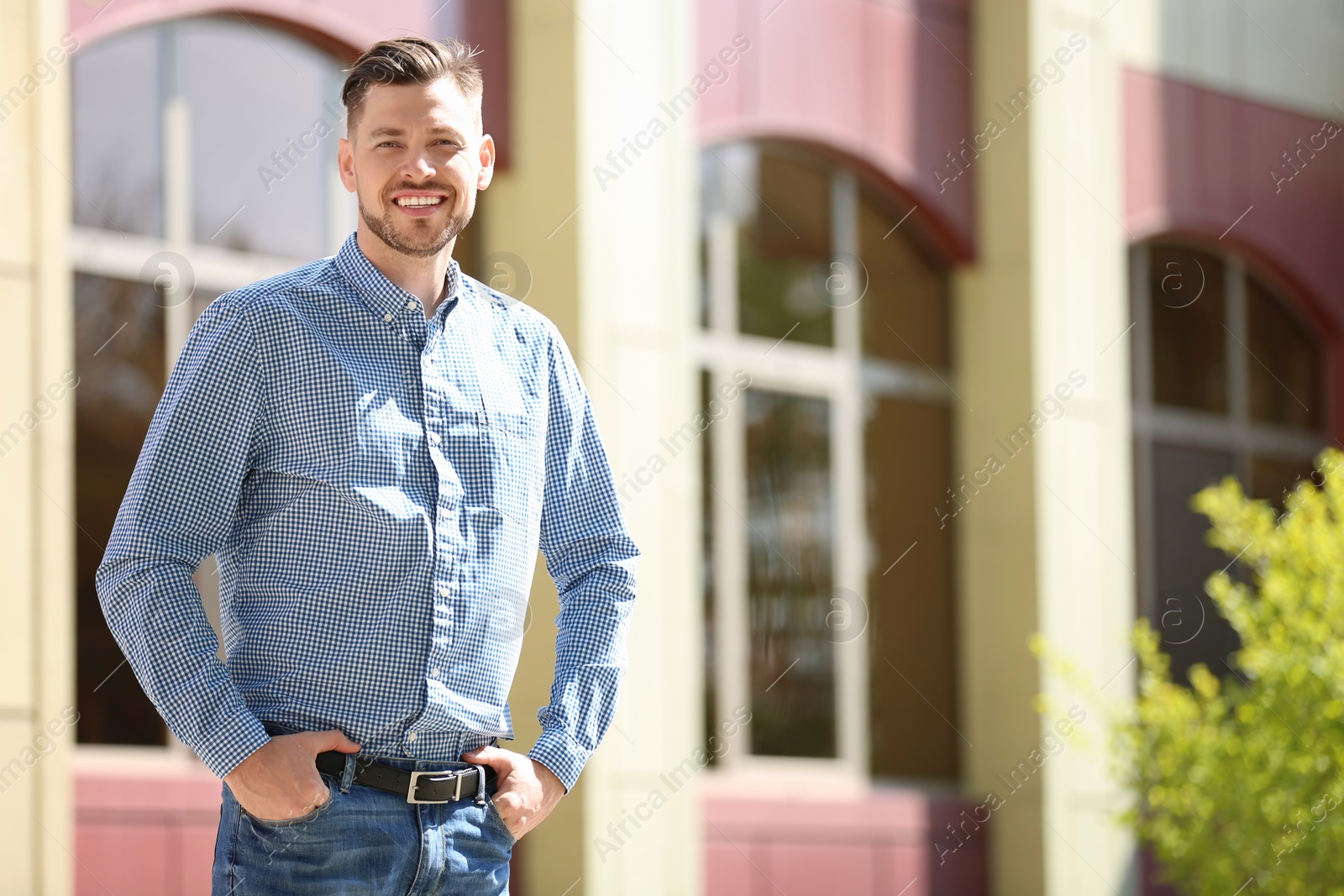 Photo of Portrait of young man in stylish outfit outdoors