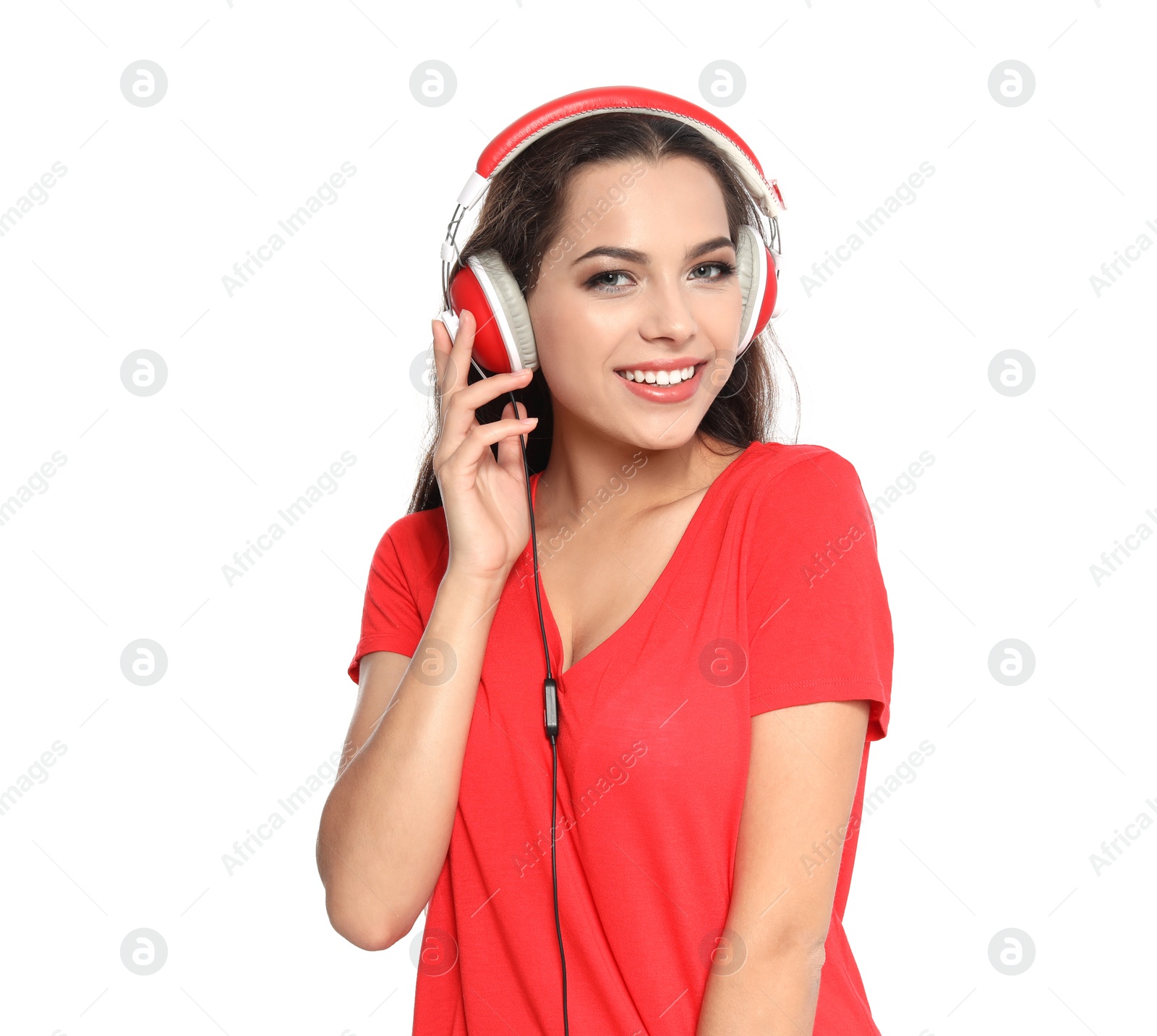 Photo of Young woman listening to Christmas music on white background
